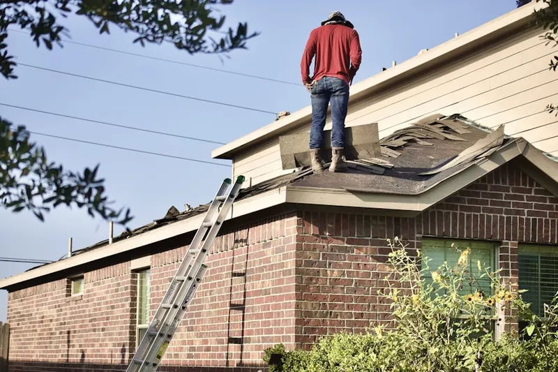 Professional roofer working on a residential roof in Bayshore